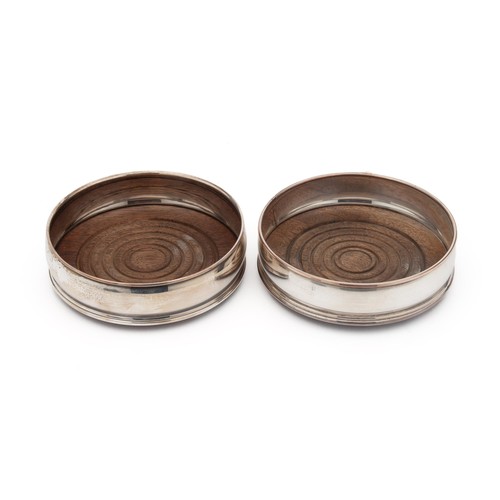 820 - A PAIR OF ELECTROPLATED WINE COASTERS