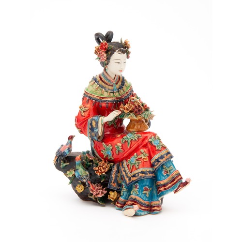 402 - A JAPANESE STONEWARE FIGURE OF A SEATED LADY