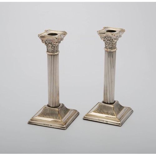 781 - A PAIR OF ELECTROPLATE CANDLESTICKS