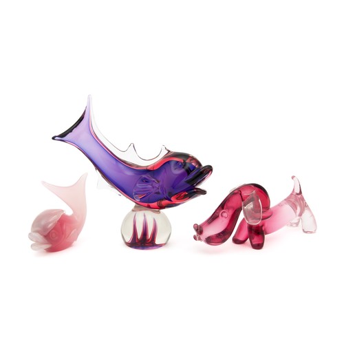 367 - A PURPLE GLASS DOLPHIN PERCHED ON A BALL, A PINK OPALINE GLASS WHALE AND A CRANBERRY AND PINK SAUSAG... 