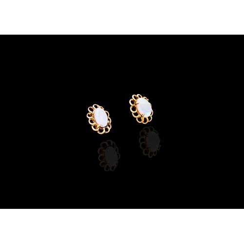 937 - A PAIR OF OPAL EARRINGS