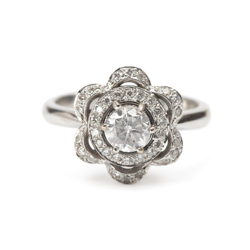 906 - A NATURAL DAISY CLUSTER DIAMOND DRESS RING, 0.30 CARATS