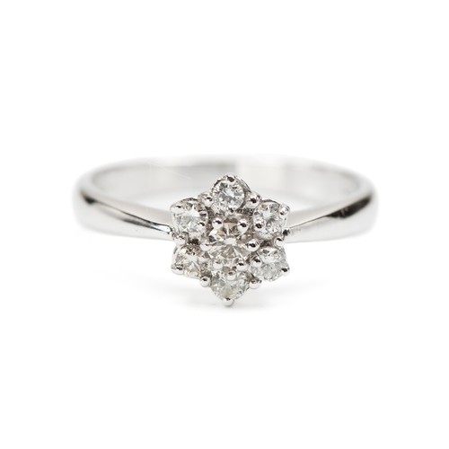 909 - A NATURAL DIAMOND CLUSTER RING, 0.25 CARATS