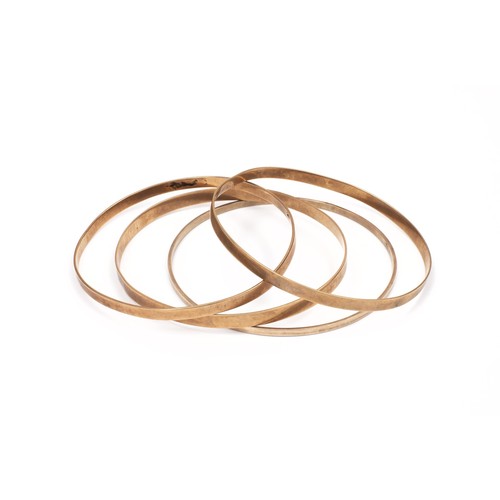 954 - A SET OF GOLD BANGLES