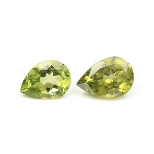 885 - A PAIR OF UNSET PERIDOTS, 3.40 CARATS