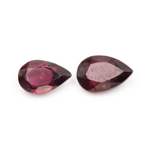 883 - A PAIR OF UNSET RUBELITES, 0.96 CARATS