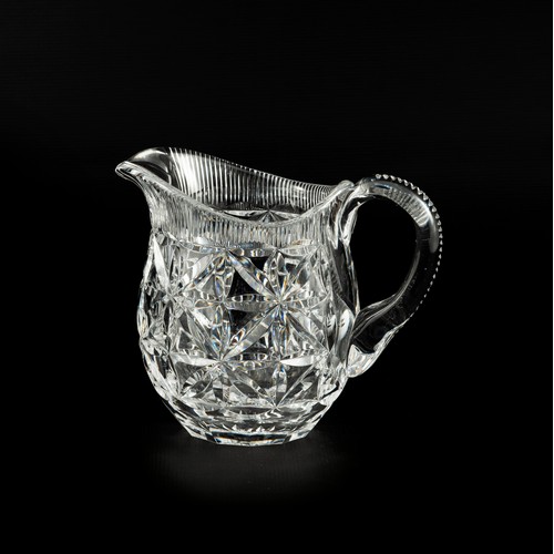 487 - A CRYSTAL GLASS JUG