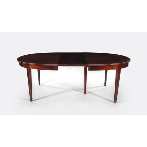 1002 - A GEORGE III STYLE MAHOGANY EXTENDING DINING TABLE