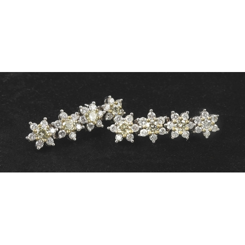 26 - A SUITE OF DIAMOND HALO JEWELLERY, 37.25 CARATS, CIRCA 1972