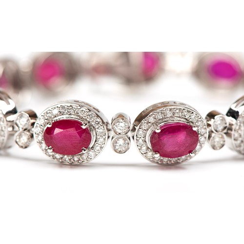 33 - A NATURAL 3.60 CARAT DIAMOND AND 18.50 CARAT RUBY BRACELET