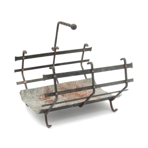 621 - A CAST IRON FIREWOOD HOLDER