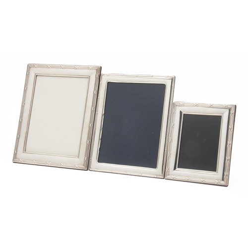 1100 - THREE SILVER-PLATE PICTURE FRAMES