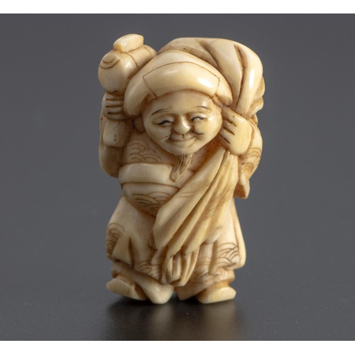 253 - A JAPANESE MARINE TUSK NETSUKE