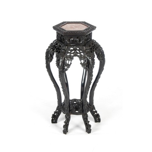 331 - AN EASTERN EBONISED MARBLE-TOPPED PLANT STAND