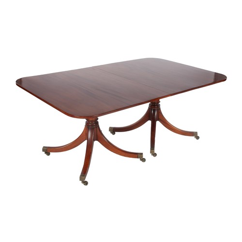 427 - A MAHOGANY EXTENDING DINING TABLE