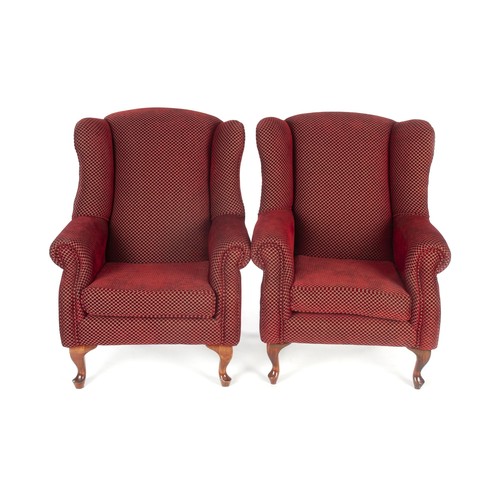 389 - A PAIR OF UPHOLSTERED WING BACK ARMCHAIRS