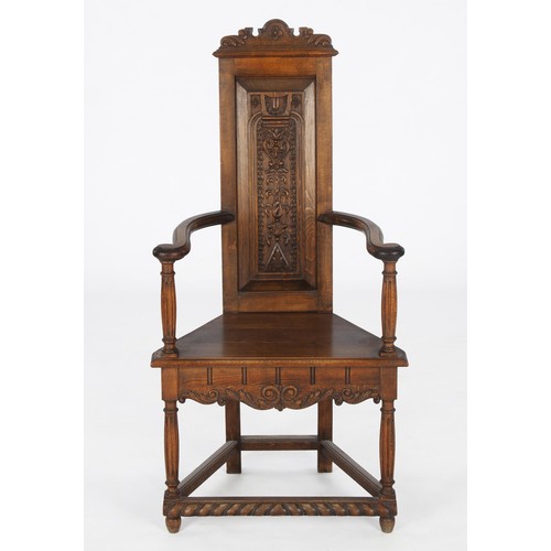 409 - A CARVED OAK HALL ARMCHAIR