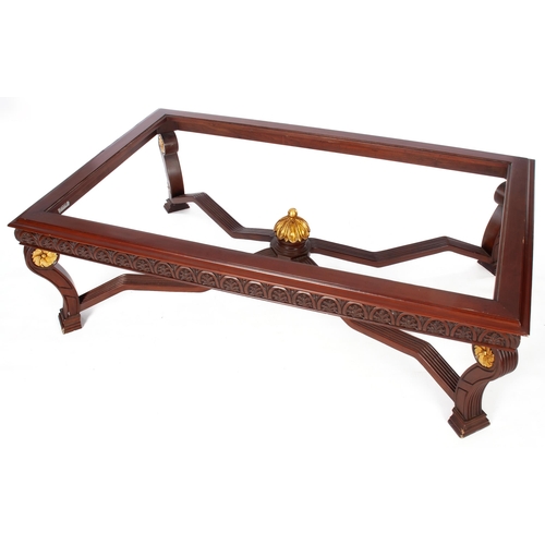 876 - A MAHOGANY AND GILT COFFEE TABLE