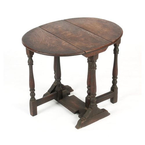 952 - AN OAK GATELEG TABLE