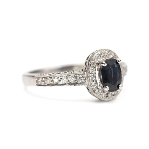 764 - A NATURAL DIAMOND AND SAPPHIRE DRESS RING