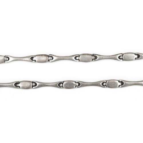 717 - A PAIR OF SILVER BRACELETS