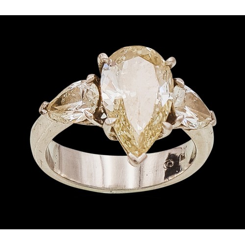A G.I.A. CERTIFIED NATURAL TRILOGY DIAMOND DRESS RING, 3.22 CARATS