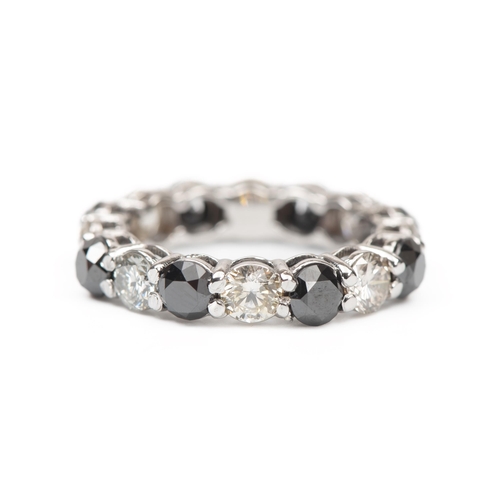 A BLACK AND WHITE NATURAL FULL DIAMOND ETERNITY RING, 5.45 CARATS