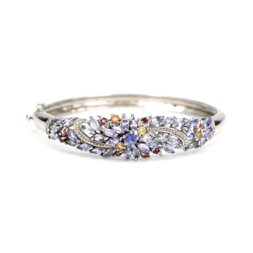 246 - A SILVER TANZANITE BANGLE, 5.00 CARATS