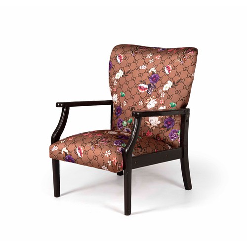 1239 - AN EBONISED AND UPHOLSTERED ARMCHAIR