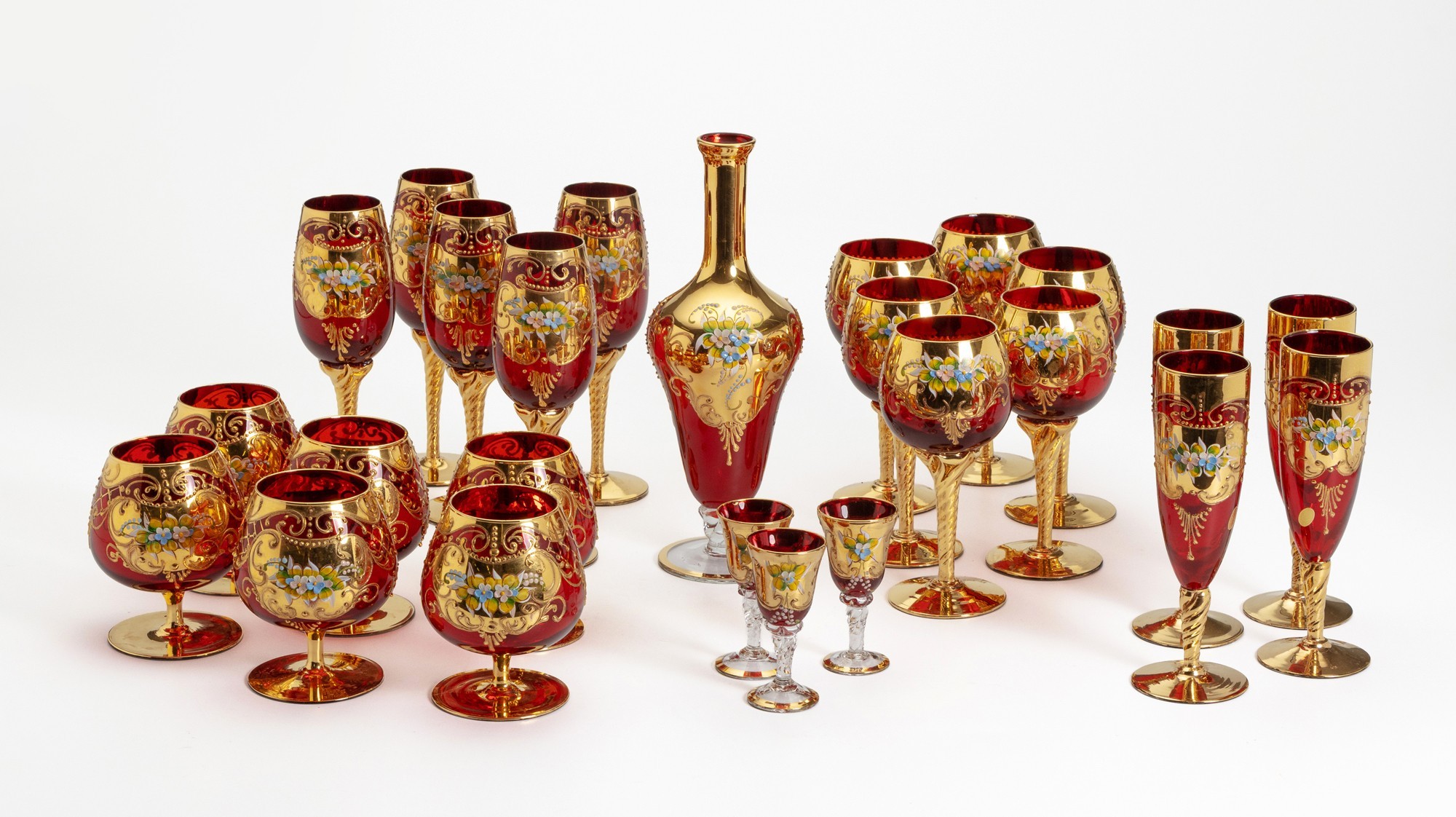 A HAND PAINTED VENETIAN RUBY RED GLASSWARE SET, ITALY