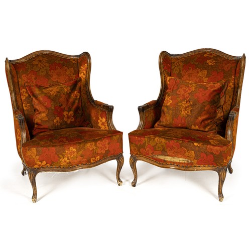 1251 - A PAIR OF UPHOLSTERED WINGBACK ARMCHAIRS