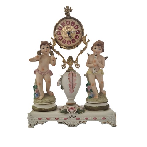 A GILT AND PORCELAIN CLOCK, MODERN