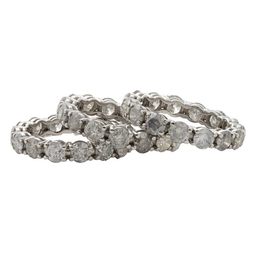 753 - A SET OF THREE FULL NATURAL DIAMOND ETERNITY RINGS, 8.36 CARATS