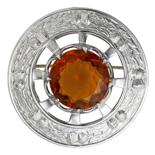 761 - A GEMSTONE AND WHITE METAL SASH BROOCH