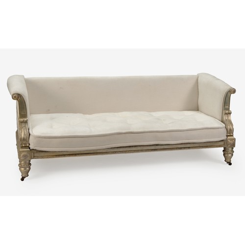 AN UPHOLSTERED SETTEE