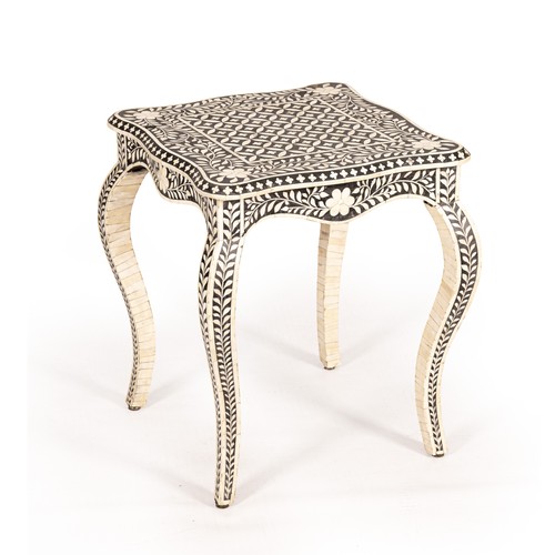 AN EBONISED AND BONE INLAID SIDE TABLE