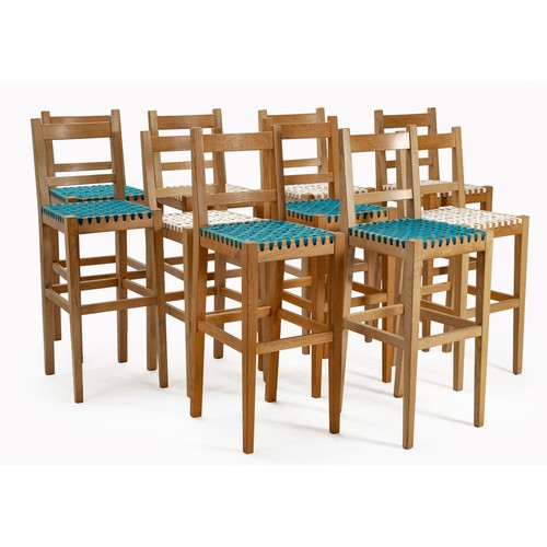 A SET OF EIGHT FRENCH OAK BAR STOOLS, MANUFACTURED BY PIERRE CRONJE