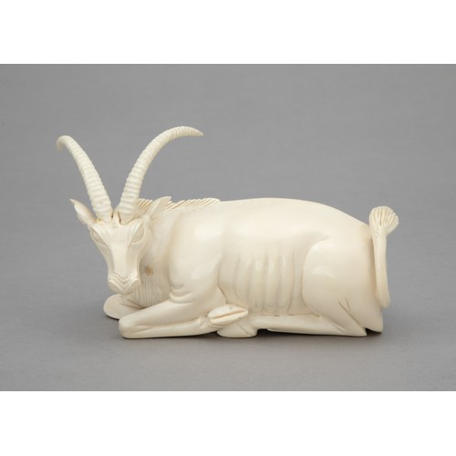 47 - A CARVED TUSK ANTELOPE FIGURINE