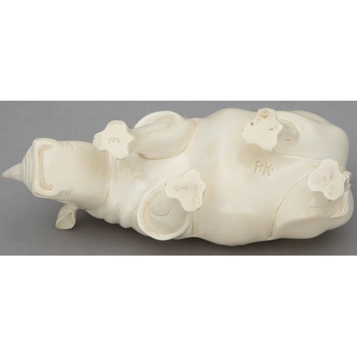 48 - A PAIR OF CARVED TUSK RHINO FIGURINES, ONE SIGNED 'P.K'