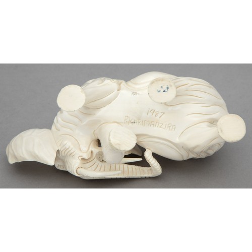 46 - A CARVED TUSK ELEPHANT FIGURINE, SIGNED PRARIMANZIRA, 1987