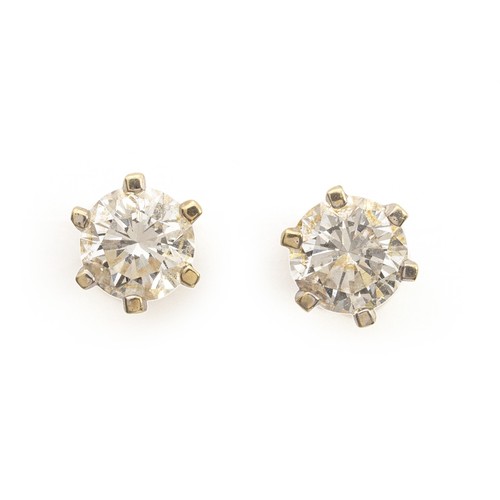 448 - A .60 CARAT PAIR OF NATURAL DIAMOND STUDS