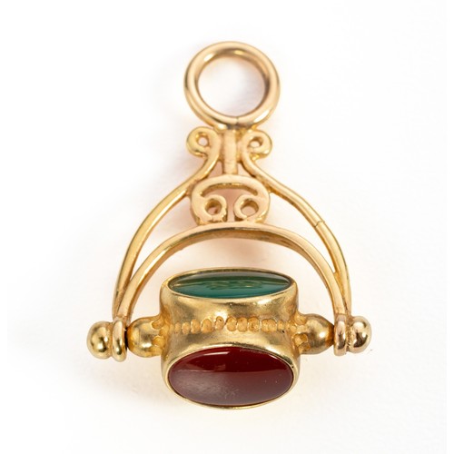 397 - A GOLD SWIVEL SEAL
