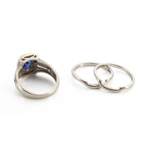 328 - A SILVER AND SAPPHIRE RING