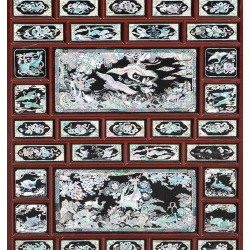 929 - A LACQUER AND MOTHER-OF-PEARL INLAID CABINET