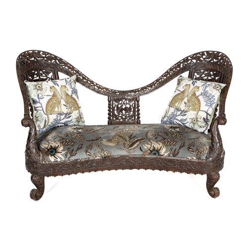 AN ANGLO-INDIAN AND ARDMORE UPHOLSTERED SPOON BACK SETTEE