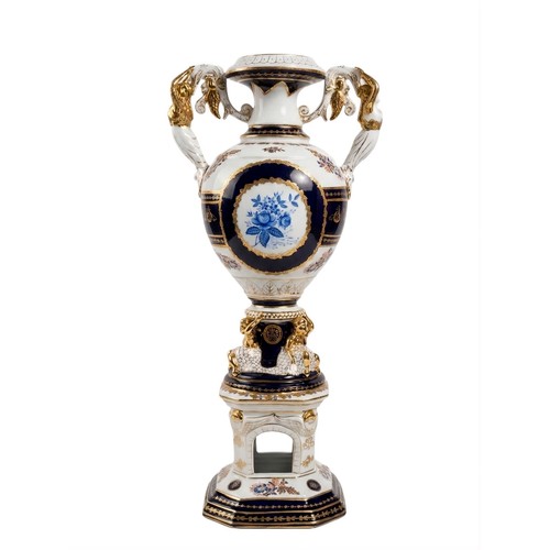 556 - A LARGE CERAMIC URN ON A PEDESTAL