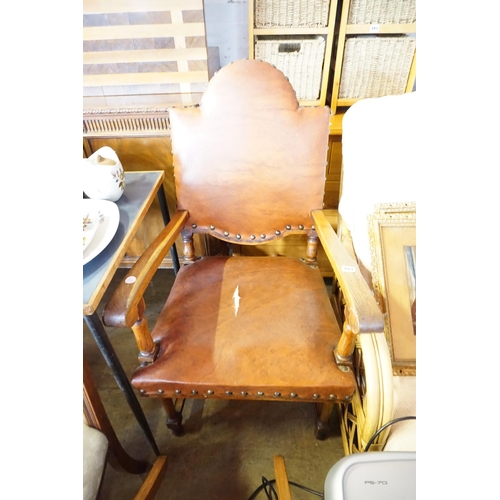 184 - An oak and upholstered armchair