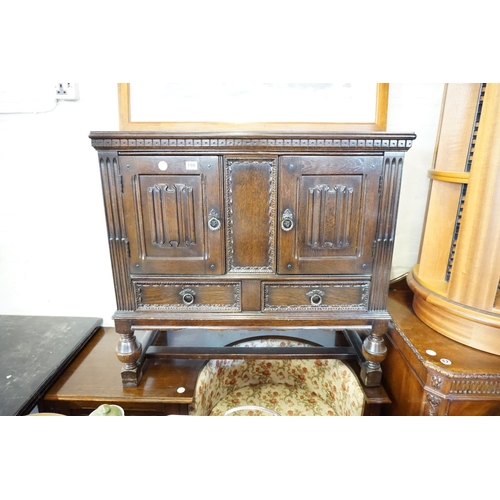 190 - A linen fold style oak cabinet