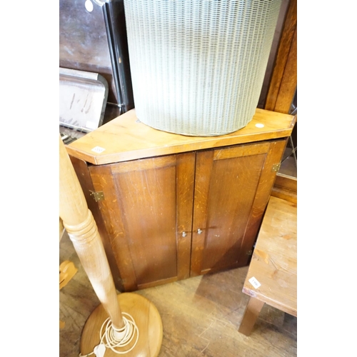 200 - An oak corner cabinet