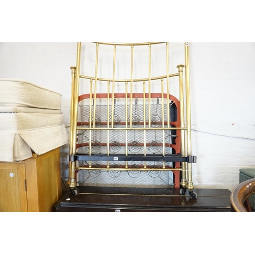 207 - A brass single bed with spring and irons